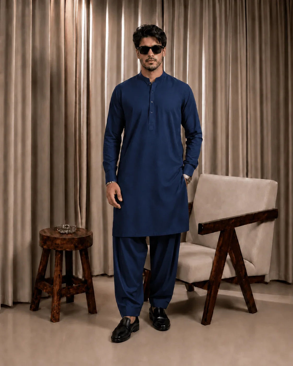 Man in navy blue unstitched suiting fabric kurta and shalwar, formal men's wear for festive or business occasions